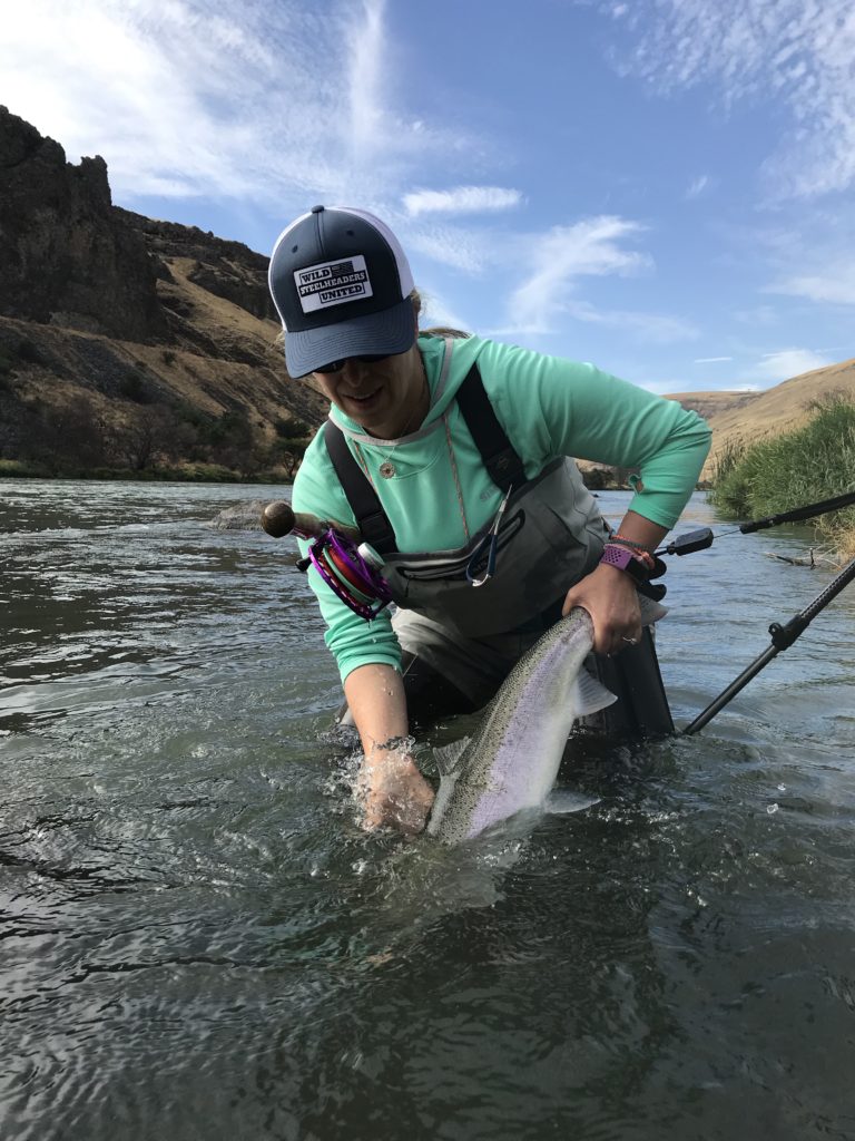 STEELHEAD OUTFITTERS LANDING THE BIG ONE